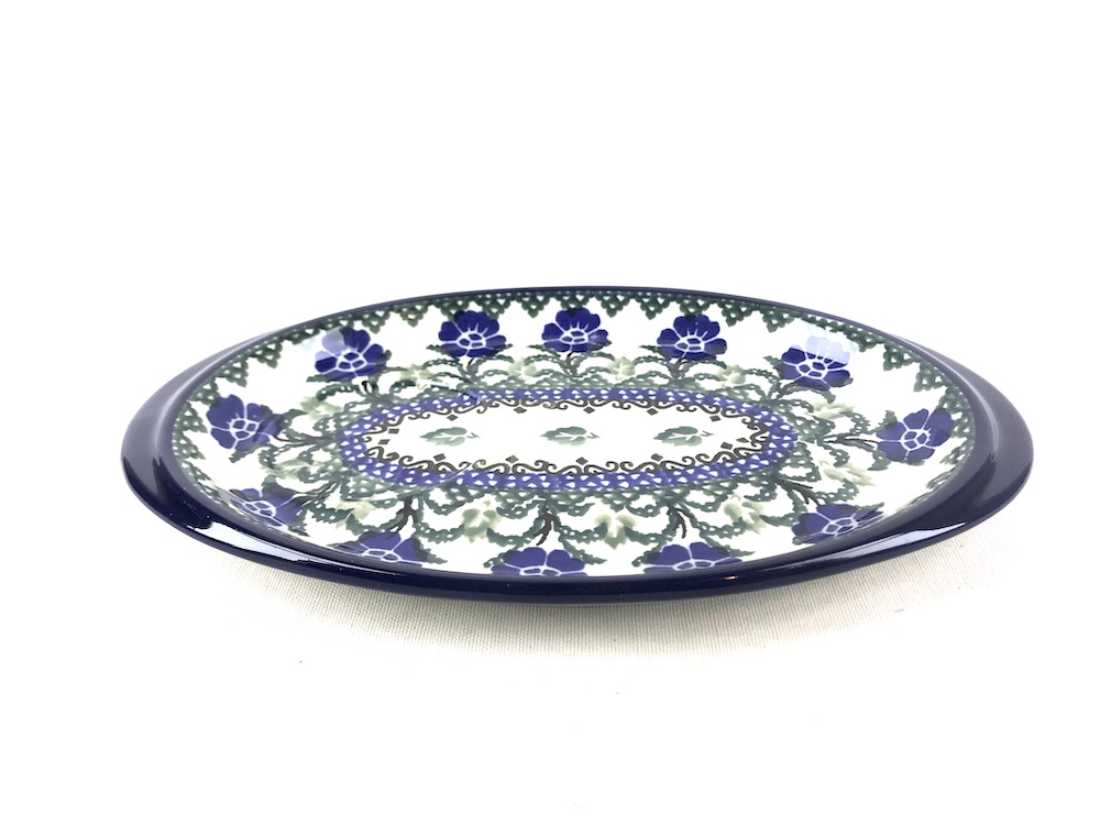 469 Bunzlau Serveer Schaaltje 2415X - 469 (Bunzlau). 469 Bunzlau Serveer Schaaltje 2415X 469 Onderbordje voor een roomstel of voor een mok met een koekje met een ronde uitsparing.