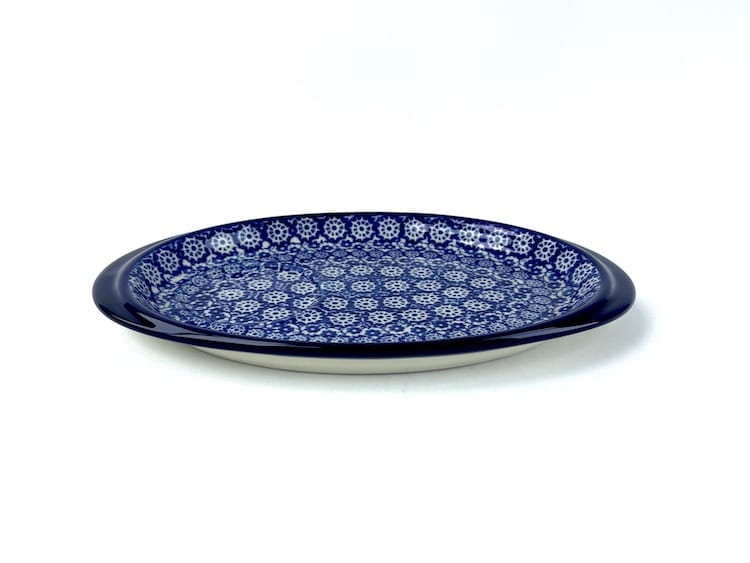 469 Bunzlau Serveer Schaaltje 2615X - 469 (Bunzlau). 469 Bunzlau Serveer Schaaltje 2615X Onderbordje voor een roomstel of voor een mok met een koekje  met een ronde uitsparing.